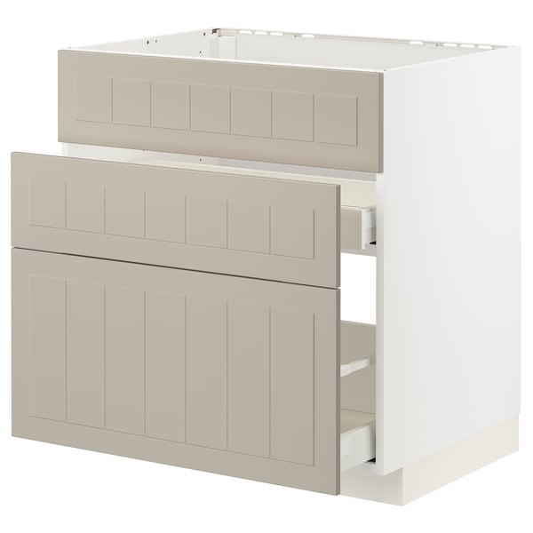 Modern beige METOD kitchen unit with soft-close drawers, vertical grooves, and light material.