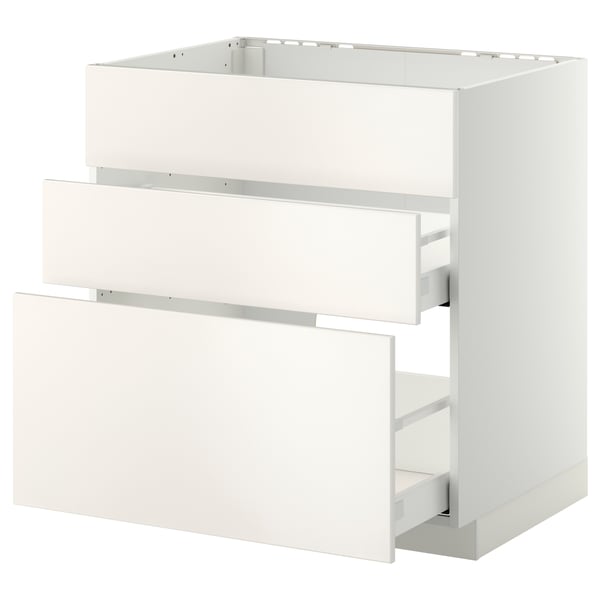 METOD white kitchen cabinet with smooth veddinge fronts, three drawers open.