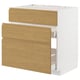 White METOD kitchen cabinet with oak drawers.
