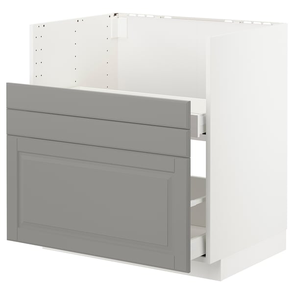 Displays a white and grey METOD kitchen cabinet with a traditional design, featuring multiple drawers in soft grey with bevelled edges.