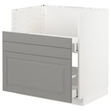 Displays a white and grey METOD kitchen cabinet with a traditional design, featuring multiple drawers in soft grey with bevelled edges.