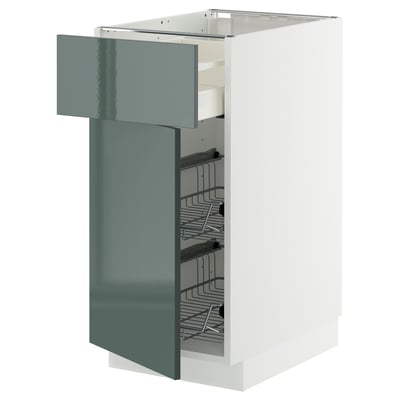 Image shows a modern kitchen cabinet with a grey-green high-gloss door and multiple wire shelves.