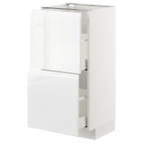 White METOD kitchen cabinet with high gloss and integrated handles.