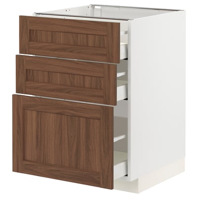 White METOD kitchen cabinet with walnut drawers.