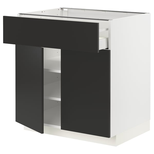 Modern black-and-white kitchen unit. Drawers and shelves. Elegant, sleek design.