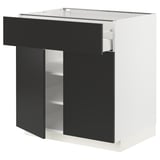 Modern black-and-white kitchen unit. Drawers and shelves. Elegant, sleek design.