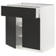 Modern black-and-white kitchen unit. Drawers and shelves. Elegant, sleek design.