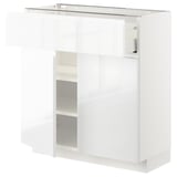 High gloss white METOD cabinet with shelves and drawers, sleek modern design.