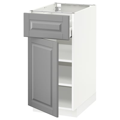 A white METOD kitchen cabinet with grey bodbyn doors and drawers, featuring a traditional design with beveled edges.