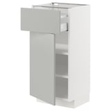 White kitchen cabinet with open shelf and drawer in light grey.