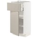 METOD kitchen unit in beige. Drawers and shelves, with a beige painted finish and smooth running drawers.