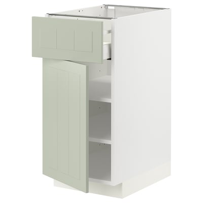 Modern kitchen cabinet in light green; METOD brand, rectangular shape, two open shelves, and a pull-out drawer on one side.