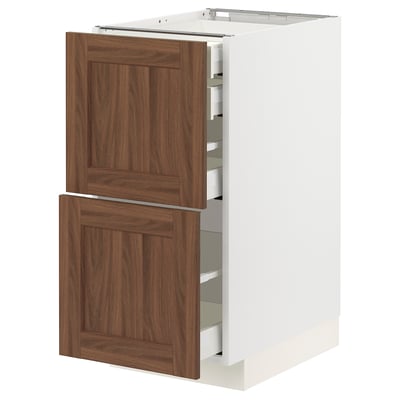 METOD kitchen cabinet with walnut foil front, wooden texture, two pull-out drawers, white base.