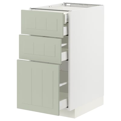 A METOD kitchen unit with green stensund fronts, featuring three drawers, a modern design, and a white base.