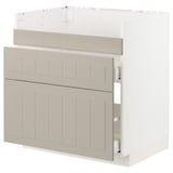 Ikea METOD kitchen unit in beige with beveled panels and drawers, part assembled.