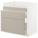 Ikea METOD kitchen unit in beige with beveled panels and drawers, part assembled.