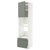 A METOD kitchen unit with a tall cabinet in white and grey-green doors. The unit has shelves and drawers for storage.