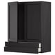 Black METOD kitchen unit with drawers and paneled doors.