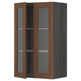 A dark wood-colored METOD kitchen cabinet with glass doors and shelves, offering a classic and stylish look.