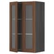 A dark wood-colored METOD kitchen cabinet with glass doors and shelves, offering a classic and stylish look.