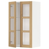 White oak-trimmed kitchen wall cabinet with glass doors.