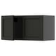 Black stained kitchen cabinet with beveled edges and wooden design.
