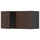 Dark brown wooden kitchen cabinet with closed door and visible hinge.