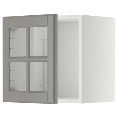 This image shows a grey METOD wall cabinet with glass doors and beveled edges, featuring a rectangular shape and modern design.
