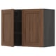 A brown METOD kitchen wall cabinet with one door open, revealing shelves inside.