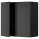 A modern black METOD wall cabinet with one open door, revealing an empty shelf inside.