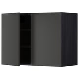 Modern black kitchen cabinet with one open door, sleek and square-shaped.