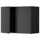 Modern black kitchen cabinet with one open door, sleek and square-shaped.
