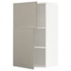A beige METOD kitchen cabinet with two doors and an adjustable shelf. It a modern, rectangular design.
