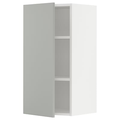 Open white METOD kitchen cabinet with light grey shelves.