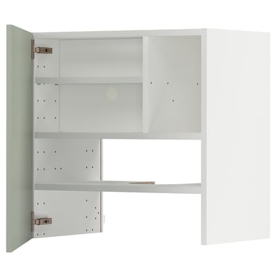 Displays a white METOD kitchen cabinet with green fronts, featuring shelves and adjustable storage.