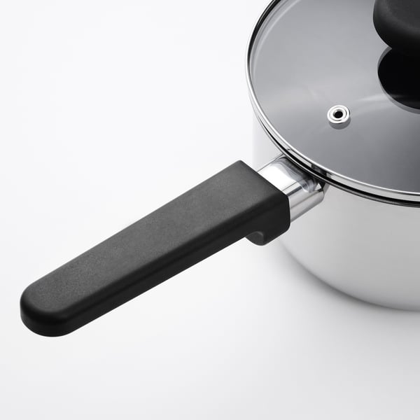 Stainless steel saucepan with black handle and clear lid, high quality, non-stick interior.