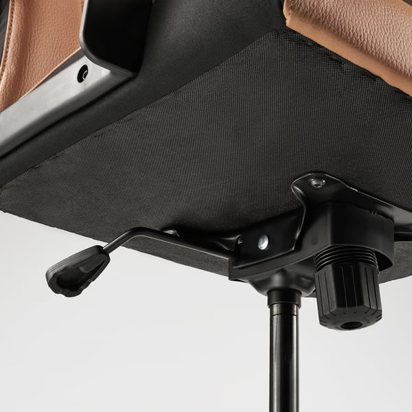 Close-up of MILLBERGET chairs adjustable base and armrest. Shows quality materials and design.