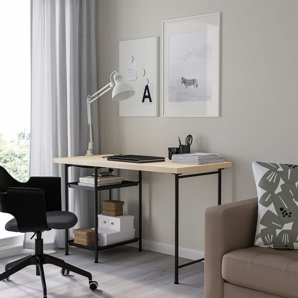 Minimalist home office: MITTCIRKEL desk, black chair, zebra print, lamp, sofa & throw pillows.