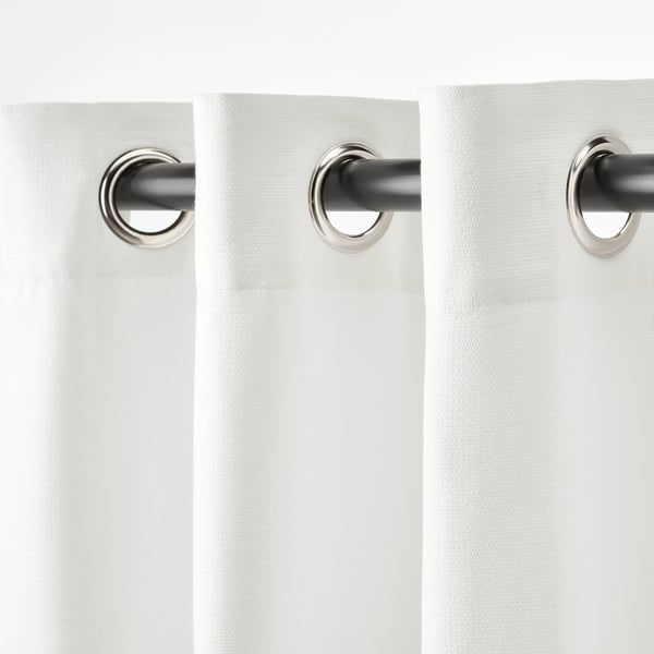 Blackout curtains with eyelets, diffused light, privacy.