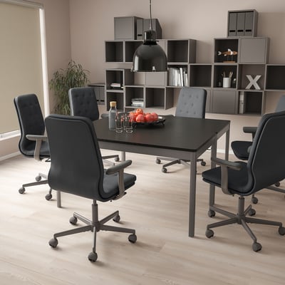 Modern conference room with MULLFJÄLLET chairs, table, and decorations.