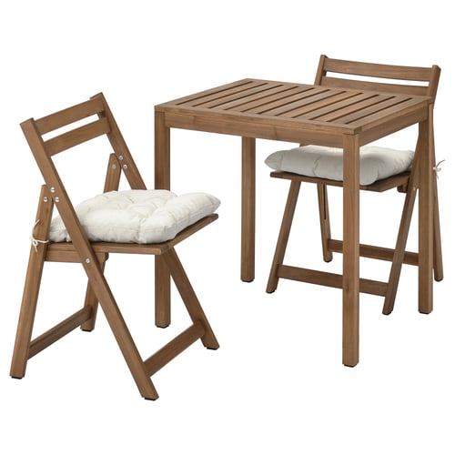 The NÄMMARÖ set in brown wood, featuring a small table and two chairs with white cushions for outdoor use.