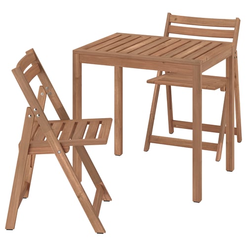 A NÄMMARÖ brown acacia wood outdoor table and chairs set.