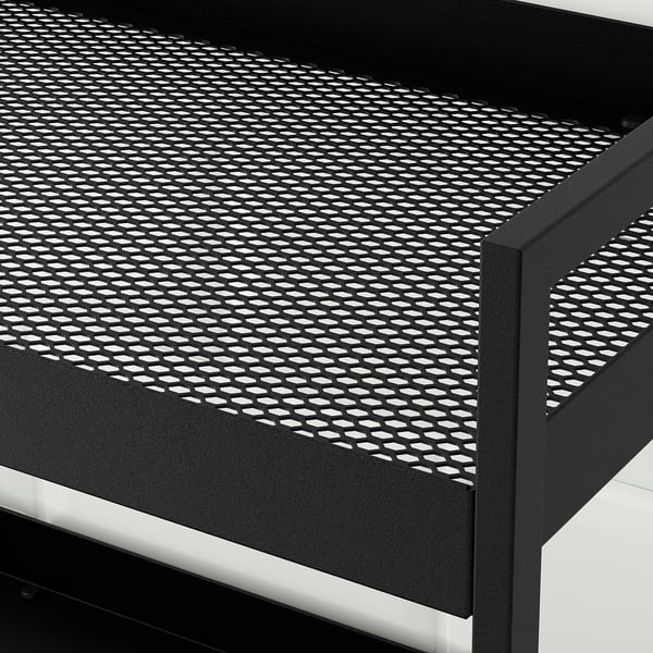 Black metal trolley with perforated shelf, sturdy and mobile.