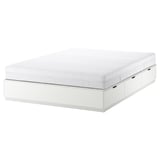 White NORDLI bed frame with 6 drawers and foam mattress. Modern, storage-friendly design.