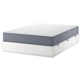 NORDLI white bed frame with 6 drawers and blue-gray mattress. Modern, space-saving design with soft-close drawers.