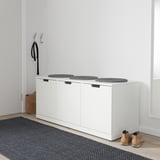 NORDLI chest with cushions, coat, bag, and boot.