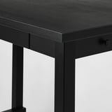Close-up of robust black wooden table with smooth surface and sturdy metal legs.