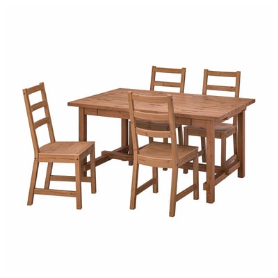 Rustic wooden dining set with rectangular table and ladderback chairs.