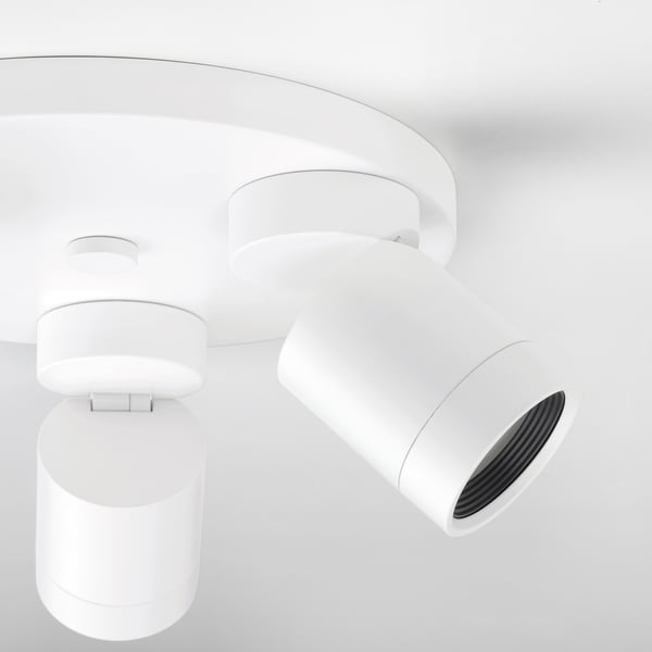 Modern white ceiling lamp with adjustable spotlights; clean, sleek design.
