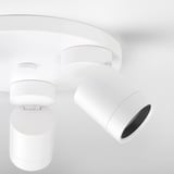 Modern white ceiling lamp with adjustable spotlights; clean, sleek design.